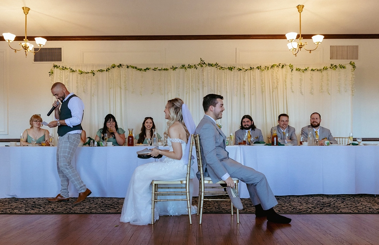 An image of a wedding DJ hosting the Shoe Game.